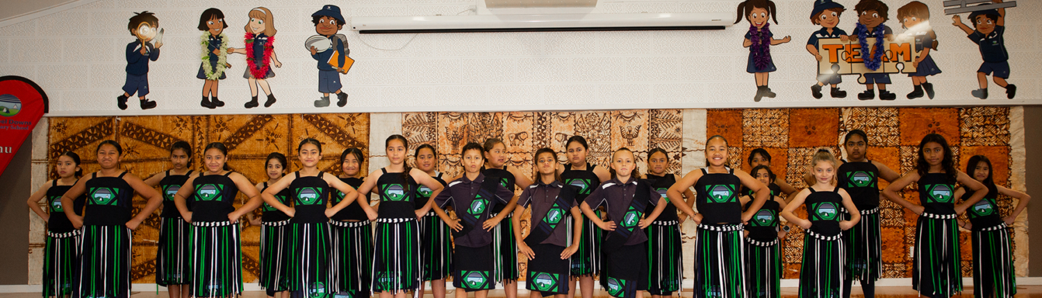 Lots of kids on stage doing Kapa Haka